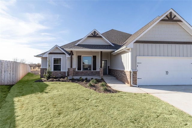 craftsman-style house featuring covered porch, a garage, and a front lawn