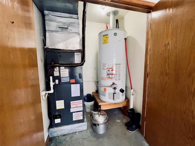 utility room with heating unit and water heater