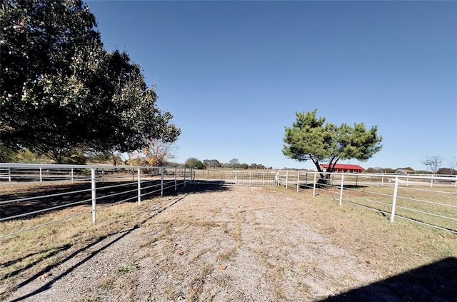 view of yard with a rural view