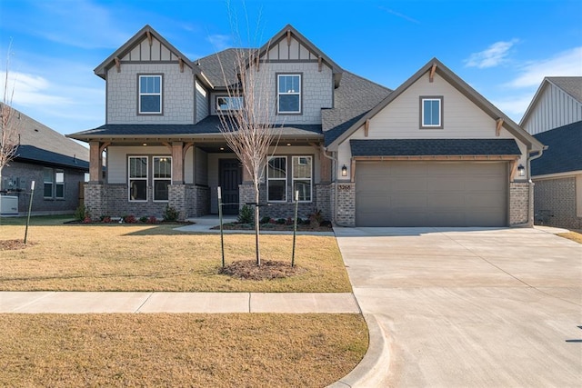 craftsman inspired home with a front yard and a garage