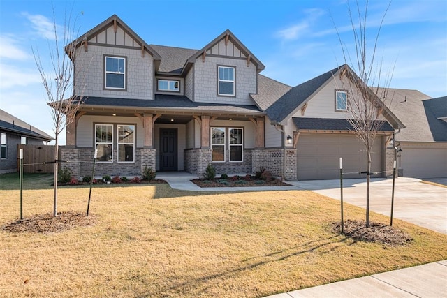 craftsman house featuring a front lawn and covered porch