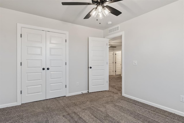 unfurnished bedroom featuring ceiling fan, carpet floors, and a closet