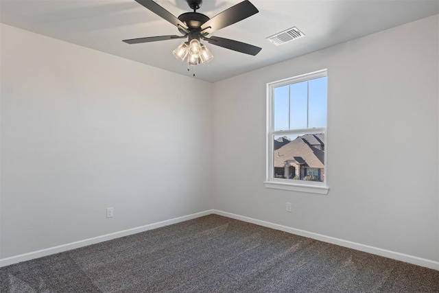 empty room featuring carpet floors and ceiling fan