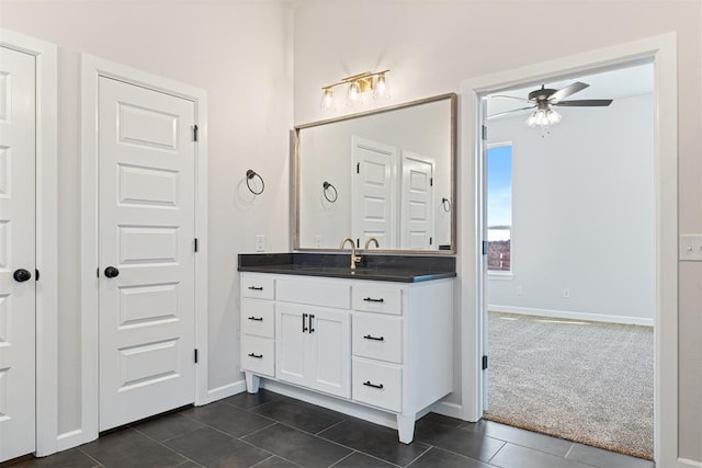 bathroom with tile patterned floors, ceiling fan, and vanity