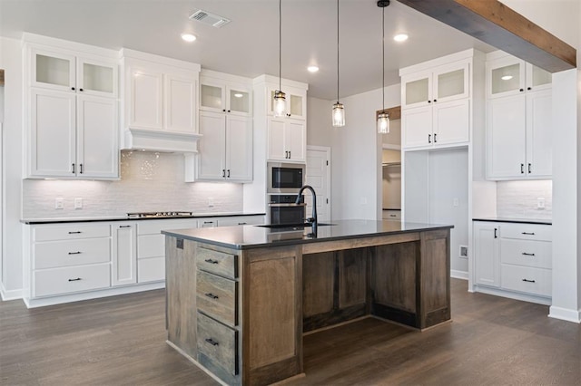 13268 Sawtooth Oak Rd, Choctaw, OK 73020 - kitchen featuring appliances with stainless steel finishes, dark countertops, dark wood-style floors, and recessed lighting