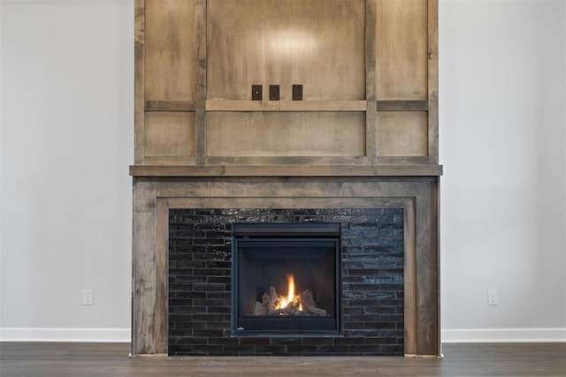 13268 Sawtooth Oak Rd, Choctaw, OK 73020 - detailed view of a lit fireplace and wood finished floors