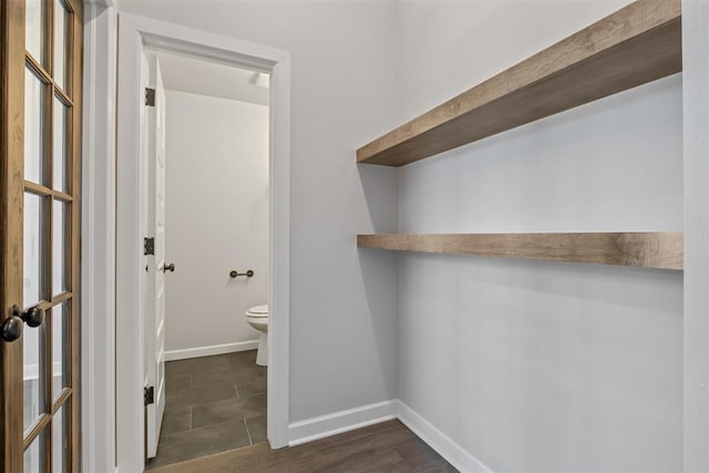 13268 Sawtooth Oak Rd, Choctaw, OK 73020 - laundry area with baseboards and dark tile patterned floors