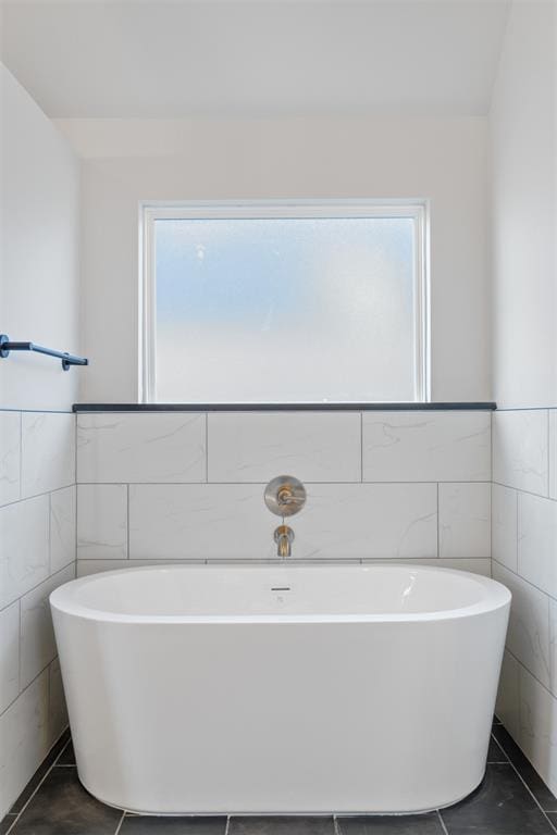 13268 Sawtooth Oak Rd, Choctaw, OK 73020 - full bath featuring tile walls, a soaking tub, wainscoting, and tile patterned flooring