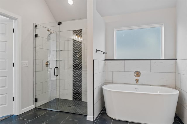 13268 Sawtooth Oak Rd, Choctaw, OK 73020 - full bathroom featuring a freestanding bath, a shower stall, tile patterned floors, and tile walls