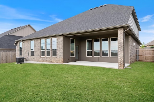 13268 Sawtooth Oak Rd, Choctaw, OK 73020 - rear view of house featuring a fenced backyard, a patio area, brick siding, and a shingled roof