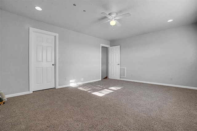 carpeted empty room with ceiling fan