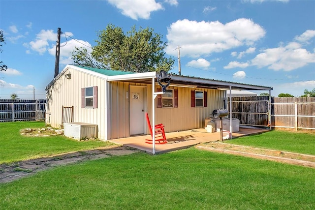 view of outbuilding featuring a yard