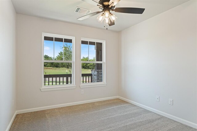 carpeted empty room with ceiling fan