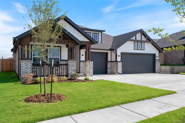 craftsman house with a garage, covered porch, and a front yard