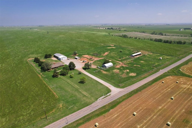 birds eye view of property with a rural view