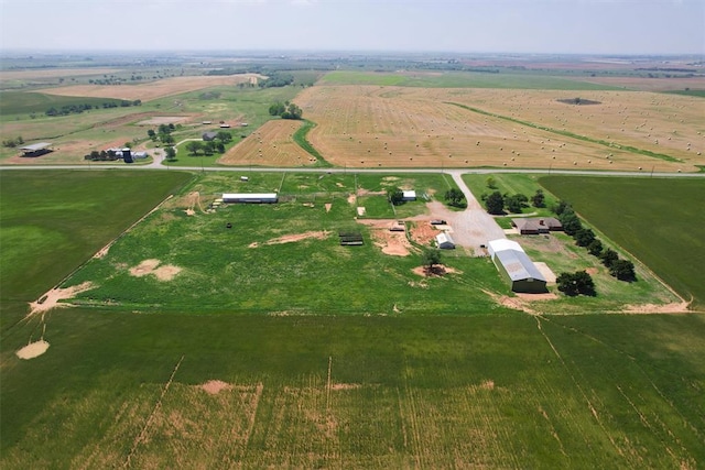 birds eye view of property featuring a rural view