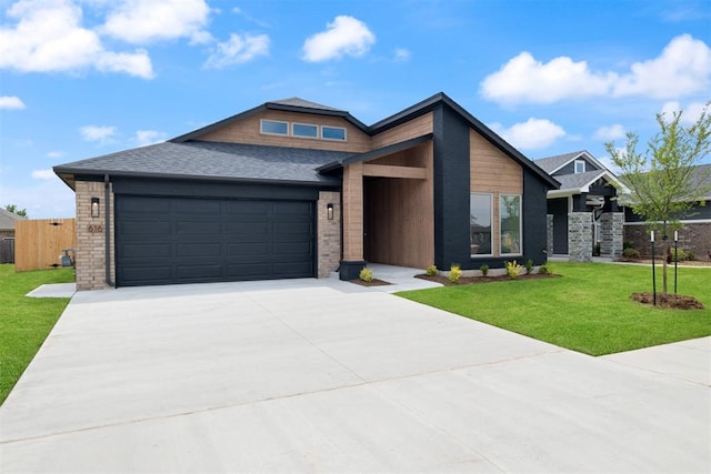 view of front of home with a garage and a front yard