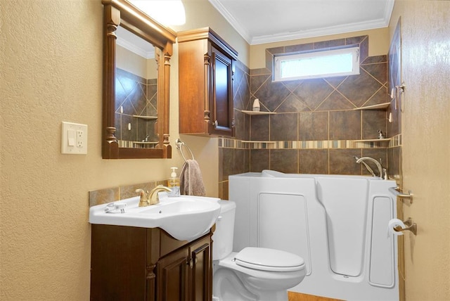 bathroom with a bathing tub, vanity, toilet, and ornamental molding