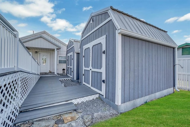 view of outbuilding with a lawn