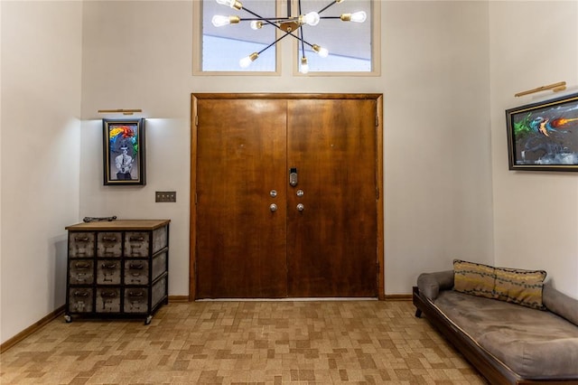 entryway featuring a notable chandelier