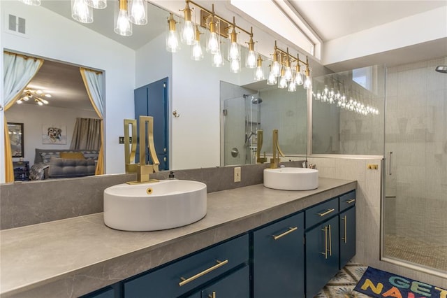 bathroom with a shower with door, vanity, and vaulted ceiling