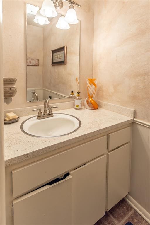 bathroom featuring tile patterned flooring and vanity