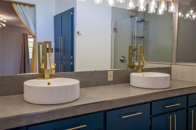 bathroom featuring vanity and an enclosed shower