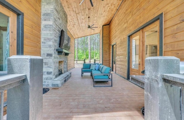 deck with an outdoor hangout area and ceiling fan