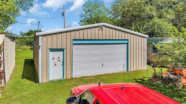 garage with a yard