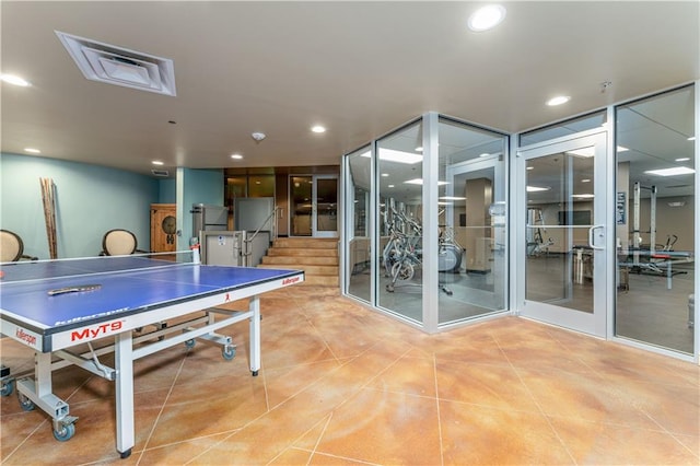 recreation room featuring light tile patterned flooring