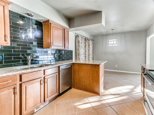 kitchen with decorative light fixtures, decorative backsplash, kitchen peninsula, and appliances with stainless steel finishes