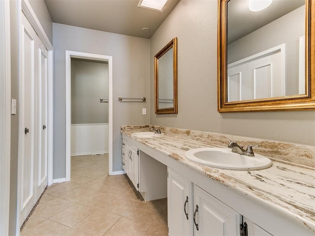 bathroom with vanity and tile patterned floors