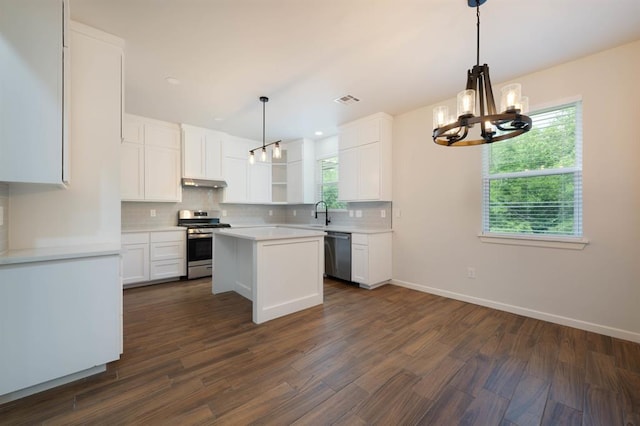 kitchen featuring white cabinets, appliances with stainless steel finishes, and a kitchen island