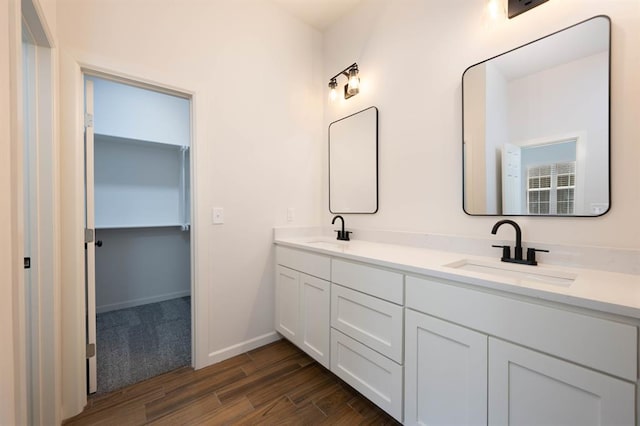 bathroom featuring vanity and wood-type flooring