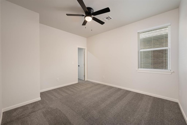 carpeted empty room featuring ceiling fan