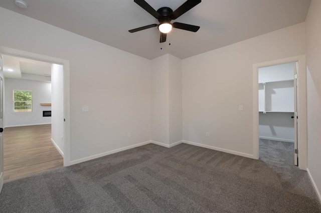 carpeted empty room with ceiling fan