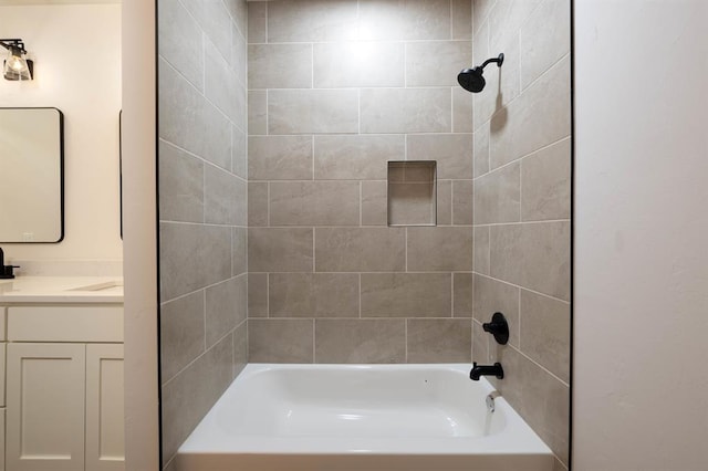 bathroom featuring vanity and tiled shower / bath combo