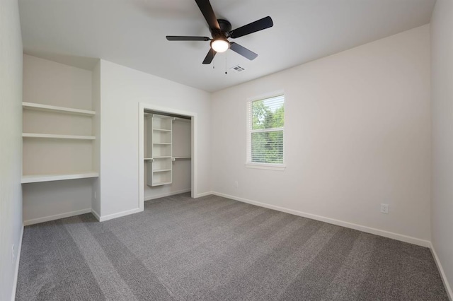 unfurnished bedroom with ceiling fan, a closet, and carpet