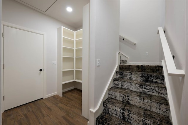 staircase with wood-type flooring