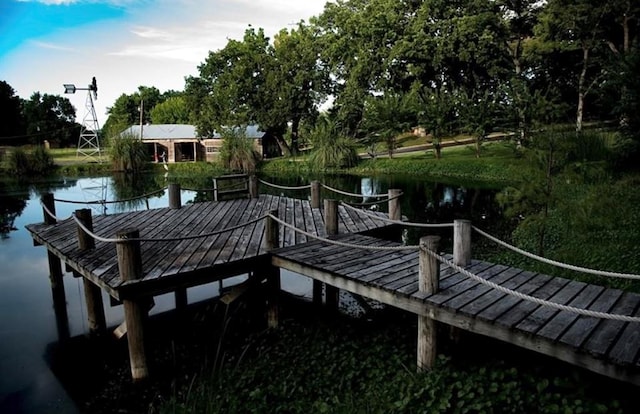 view of dock with a water view