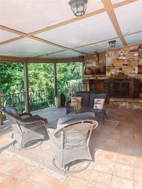 view of patio / terrace featuring an outdoor stone fireplace