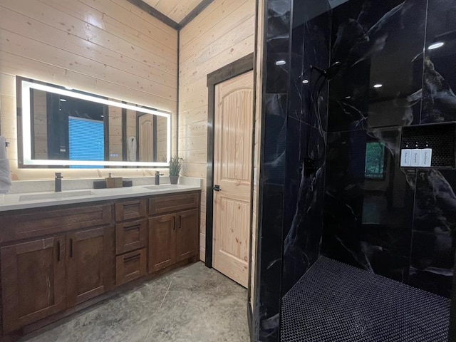 bathroom with vanity and wooden walls