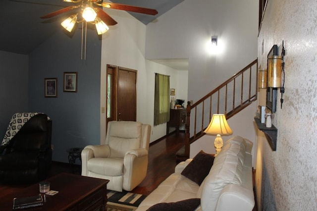 living room featuring ceiling fan, high vaulted ceiling, and dark hardwood / wood-style floors