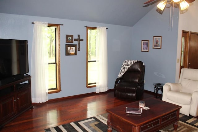 living room featuring dark hardwood / wood-style flooring, ceiling fan, and lofted ceiling