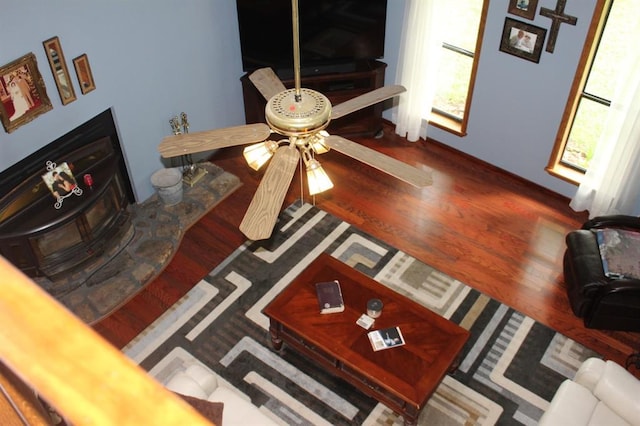 living room with ceiling fan and hardwood / wood-style floors