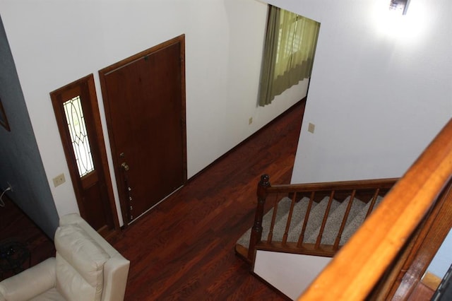 foyer with dark hardwood / wood-style floors