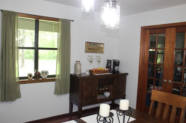 dining area with dark hardwood / wood-style floors