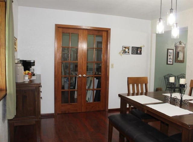 dining space featuring dark hardwood / wood-style flooring and french doors