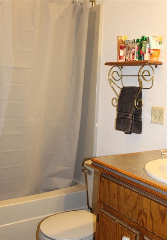 full bathroom with vanity, toilet, and shower / bath combo with shower curtain