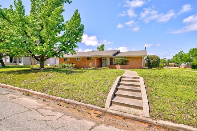 view of front of home with a front yard